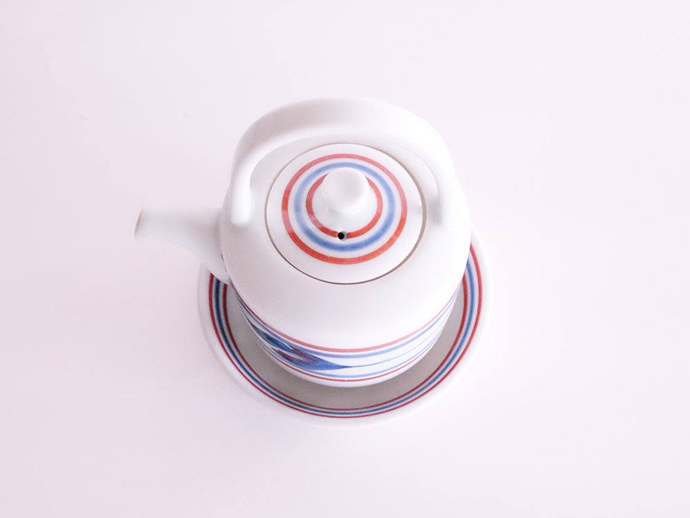 
                  
                    Red Line and Mitsuba Patterned Soy Sauce Server and Saucer by Baizan-gama
                  
                
