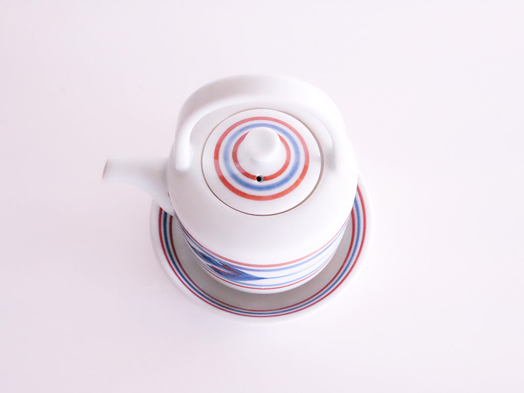 
                  
                    Red Line and Mitsuba Patterned Soy Sauce Server and Saucer by Baizan-gama
                  
                