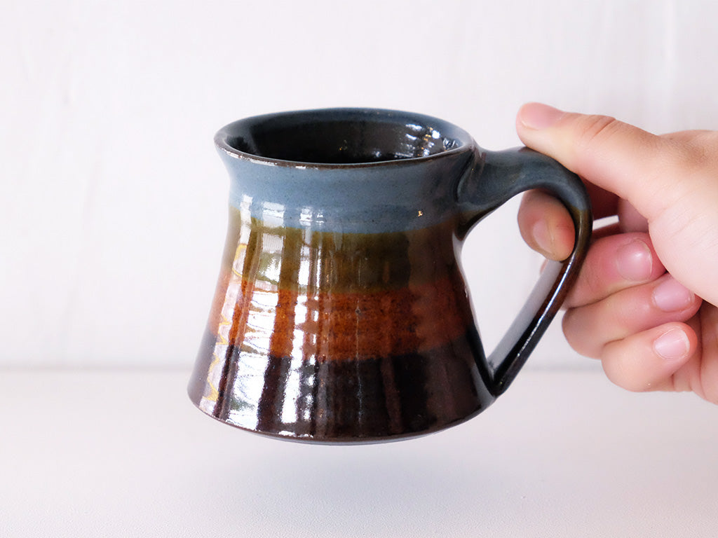 
                  
                    Coffee Mug by Giran Sagawa
                  
                