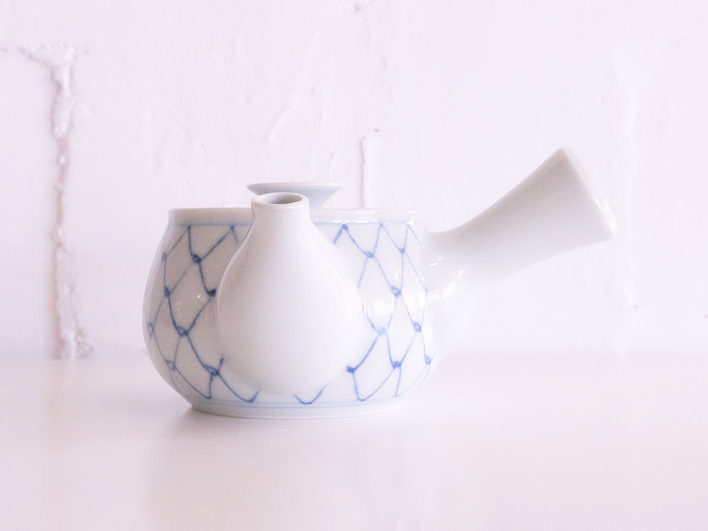 
                  
                    Lattice Pattern Kyūsu Tea Pot by Baizan-gama
                  
                