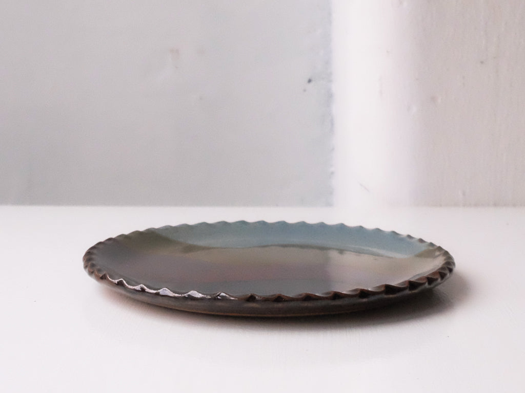 
                  
                    Earth Coloured Round Plate by Giran Sagawa
                  
                